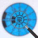 Lupe über einer blauen HU-Plakette